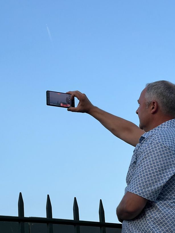 Fans zoomed in on their phones after climbing the walls around the perimeter of the park