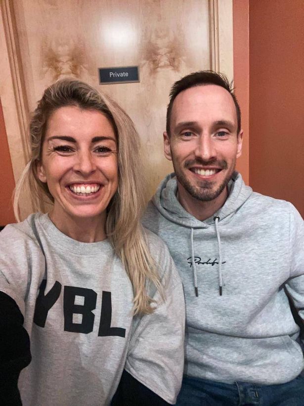 Picture showing Steven sitting beside his friend as both smile at the camera