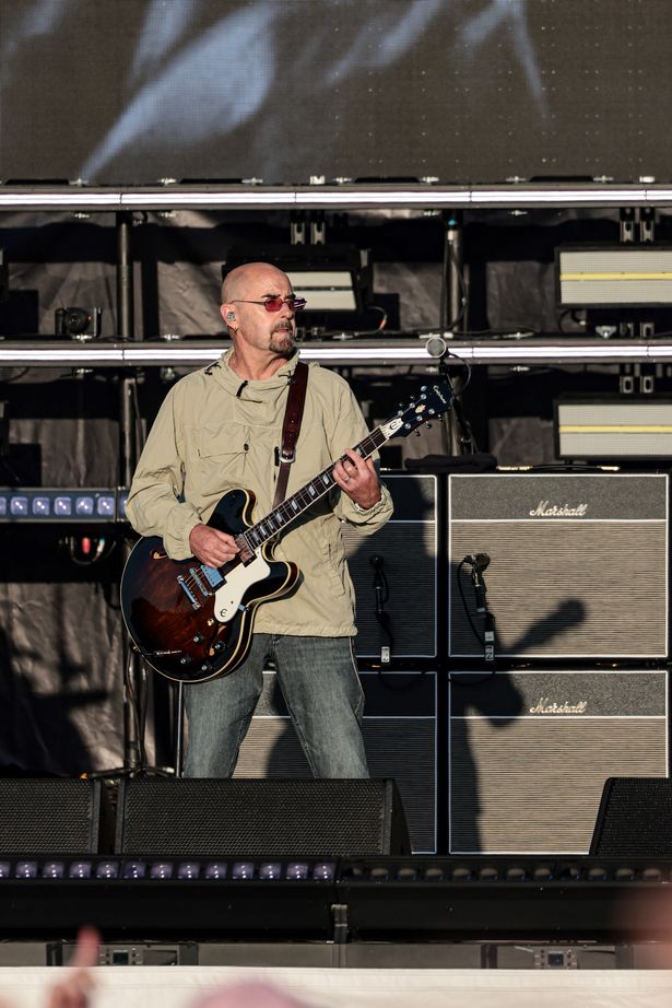Bonehead performing with Oasis at Heaton Park