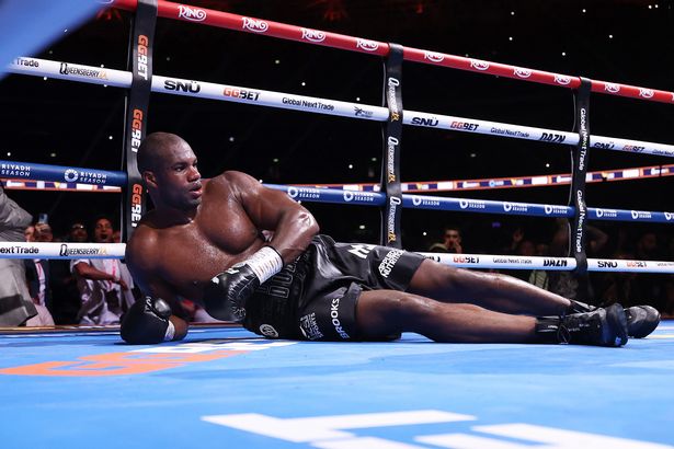 Daniel Dubois looks on after being knocked down by Oleksandr Usyk 