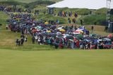 thumbnail: Spectators at The Open in Royal Portrush have faced heavy showers this week. Photo: Desmond Loughery/Pacemaker