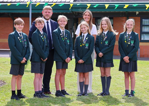 Malvern Primary School, Huyton pictured Headteacher Tony James and Deputy Headteacher Natalie McGorian with pupils.