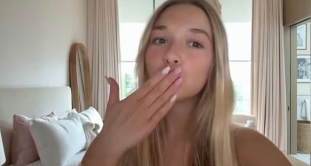 Harper Beckham blows a kiss to the camera at the end of the make-up tutorial video 