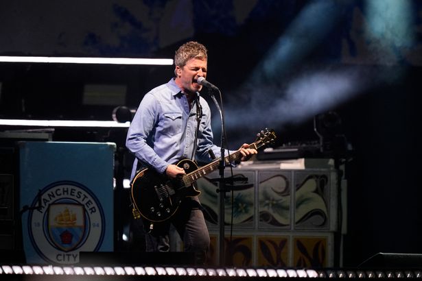 Noel Gallagher, singer and guitarist of British rock band Oasis performs on stage at the Principality Stadium in Cardiff on July 4, 2025,