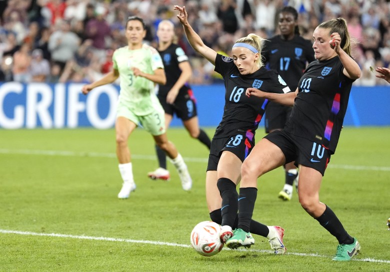 Chloe Kelly, centre, beats Ella Toone to the ball to score England's winner against Italy
