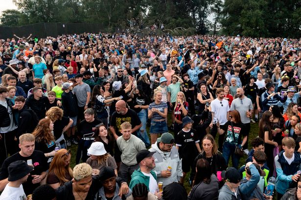 Mikey, pictured amongst the crowd wearing a hat in the bottom right, visited Gallagher Hill on all five Heaton Park shows