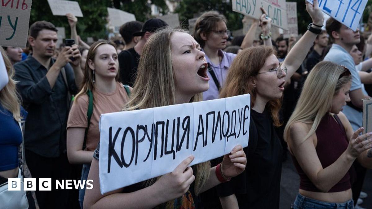 Protesters in Kyiv, Ukraine seen with placards demonstrating against a law that strips two anti-corruption bodies of their independence on 22 July, 2025.