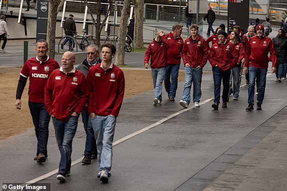MELBOURNE, AUSTRALIA - JULY 26: British & Irish Lions fans arrive at the Melbourne Exhibition Centre ahead of the second test match between Australian Wallabies and the British & Irish Lions at Melbourne Cricket Ground on July 26, 2025 in Melbourne, Australia. (Photo by Diego Fedele/Getty Images)