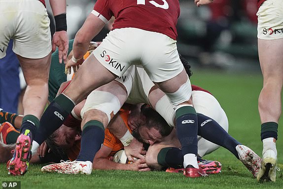 Australia's James Slipper, center, scores his side's first try during the second rugby union test against the British & Irish Lions at the Melbourne Cricket Ground in Melbourne, Australia, Saturday, July 26, 2025. (AP Photo/Asanka Brendon Ratnayake)