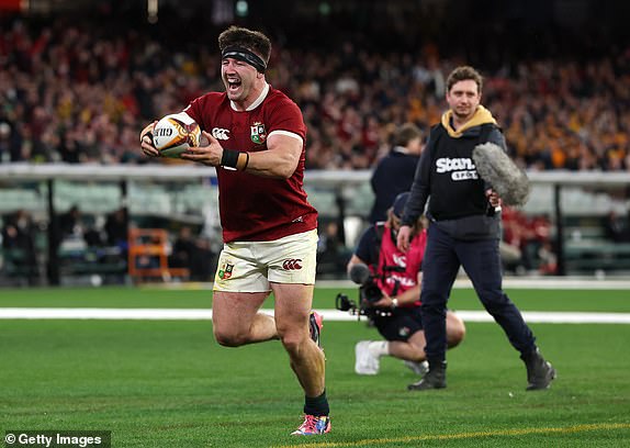 MELBOURNE, AUSTRALIA - JULY 26: Tom Curry of the British & Irish Lions celebrates after scoring his teams second try during the second test of the series between Australia Wallabies and British & Irish Lions at the Melbourne Cricket Ground on July 26, 2025 in Melbourne, Australia. (Photo by David Rogers/Getty Images)