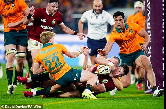 Huw Jones of the British and Irish Lions scoring his sides third try during the Qatar Airways Lions Tour 2025, second test match at the Melbourne Cricket Ground, Melbourne, Australia. Picture date: Saturday July 26, 2025. PA Photo. Photo credit should read: David Davies/PA Wire.RESTRICTIONS: Use subject to restrictions. Editorial use only, no commercial use without prior consent from rights holder.