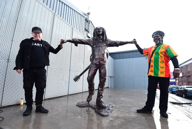Sculptor Andy Edwards and Levi Tafari by the The Bob Marley Statue
