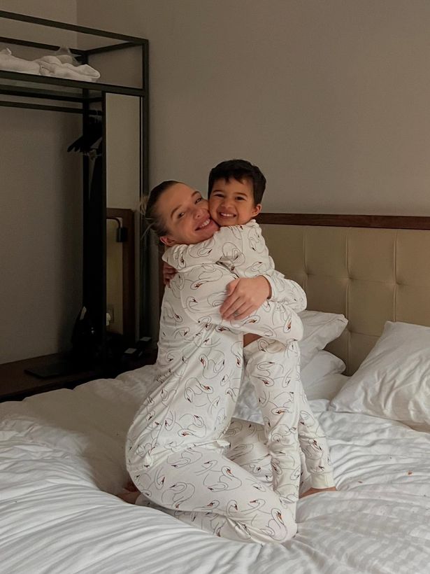 Helen Flanagan hugging her son