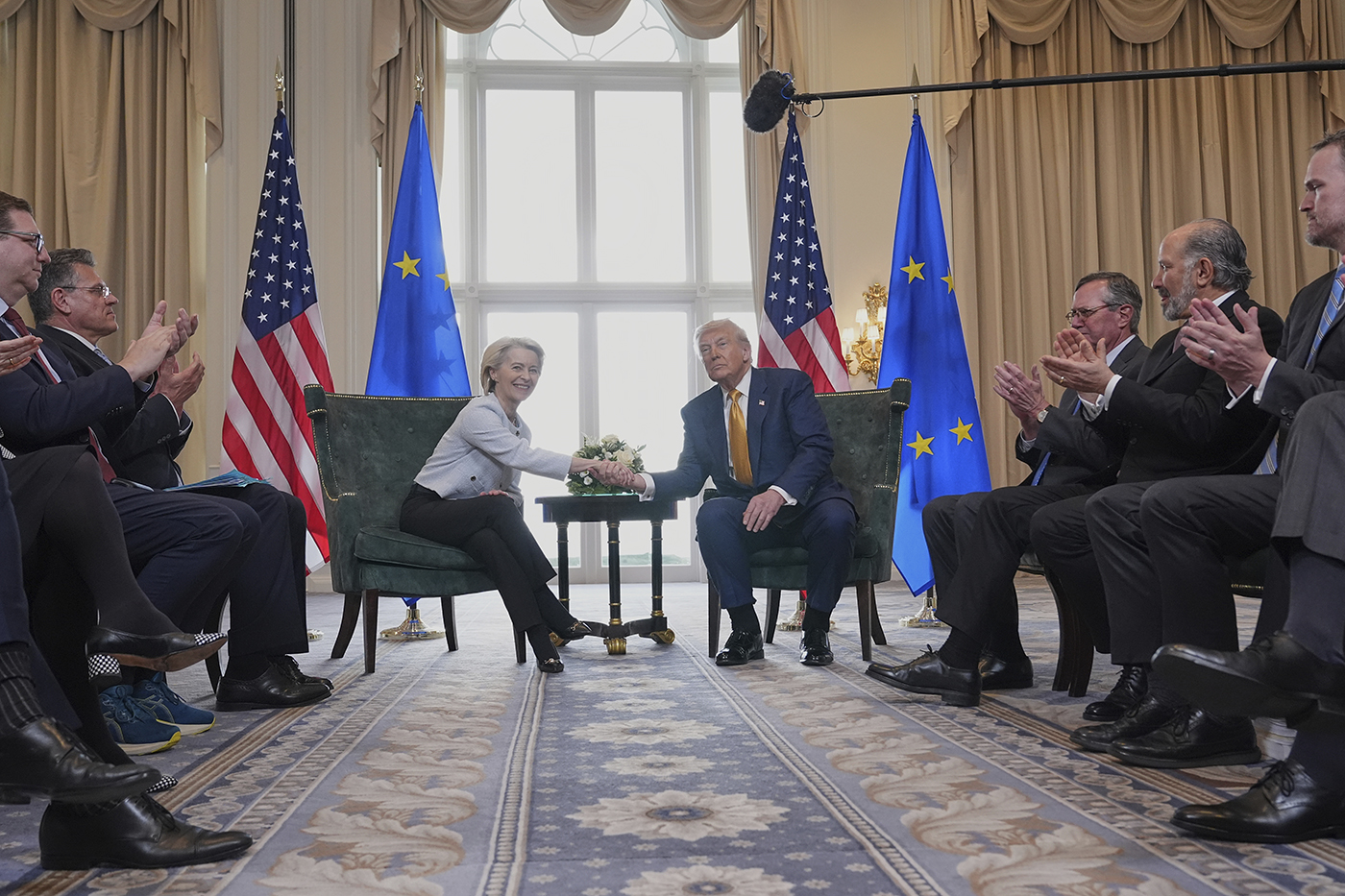President Donald Trump, right, and European Commission President Ursula von der Leyen, left, shown shaking hands while seated at a recent meeting in Scotland.