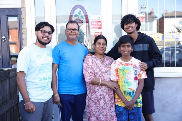 Raj Malakar, left, with his family