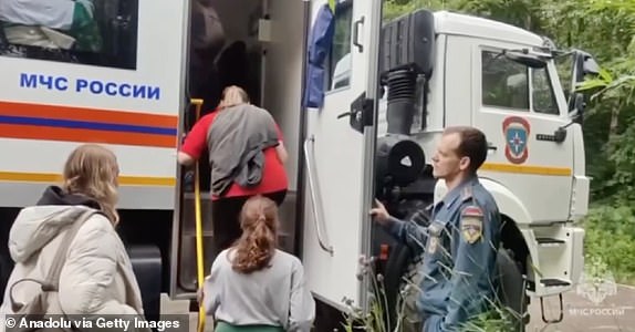 SAKHALIN OBLAST, RUSSIA - JULY 30: (----EDITORIAL USE ONLY  MANDATORY CREDIT - 'RUSSIAN MINISTRY OF EMERGENCY SITUATIONS/ HANDOUT' - NO MARKETING NO ADVERTISING CAMPAIGNS - DISTRIBUTED AS A SERVICE TO CLIENTS----) A screen grab from a video shows people being evacuated after magnitude 8.8 earthquake hits Kamchatka Peninsula and a tsunami partially flooded the area, including the grounds of the Alaid fishing enterprise, on July 30, 2025 in Sakhalin Oblast, Russia. The evacuation was carried out under the supervision of Russia's Ministry of Emergency Situations in the Sakhalin Region. In Kamchatka, about 60 vacationers were evacuated from Khalaktyrsky Beach with the help of three cross-country vehicles. No significant rise in water levels was recorded in nearby settlements. Civilians evacuated from the port of Severo-Kurilsk after a tsunami partially flooded the area. (Photo by Russia Min. of Emergency Situations / Handout/Anadolu via Getty Images)
