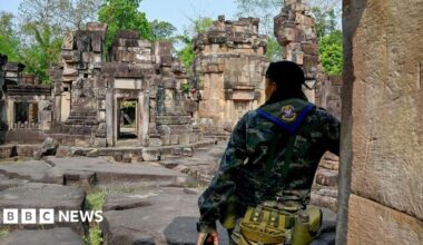 A Thai soldier stands guard at the disputed ancient Khmer temple Prasat Ta Muen Thom, at a disputed area on the Thai-Cambodian border