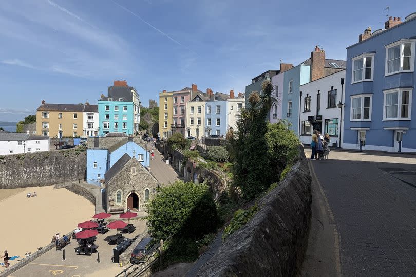 Colourful houses above a beach