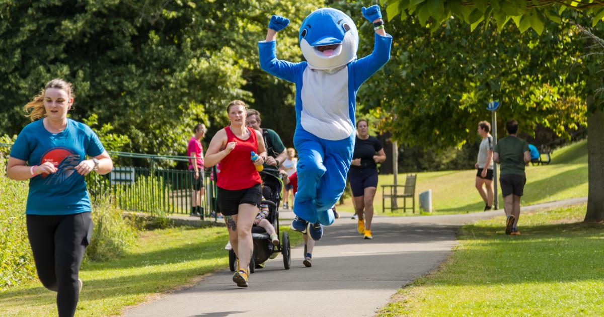 The hospital consultant running as a dolphin to save the ocean