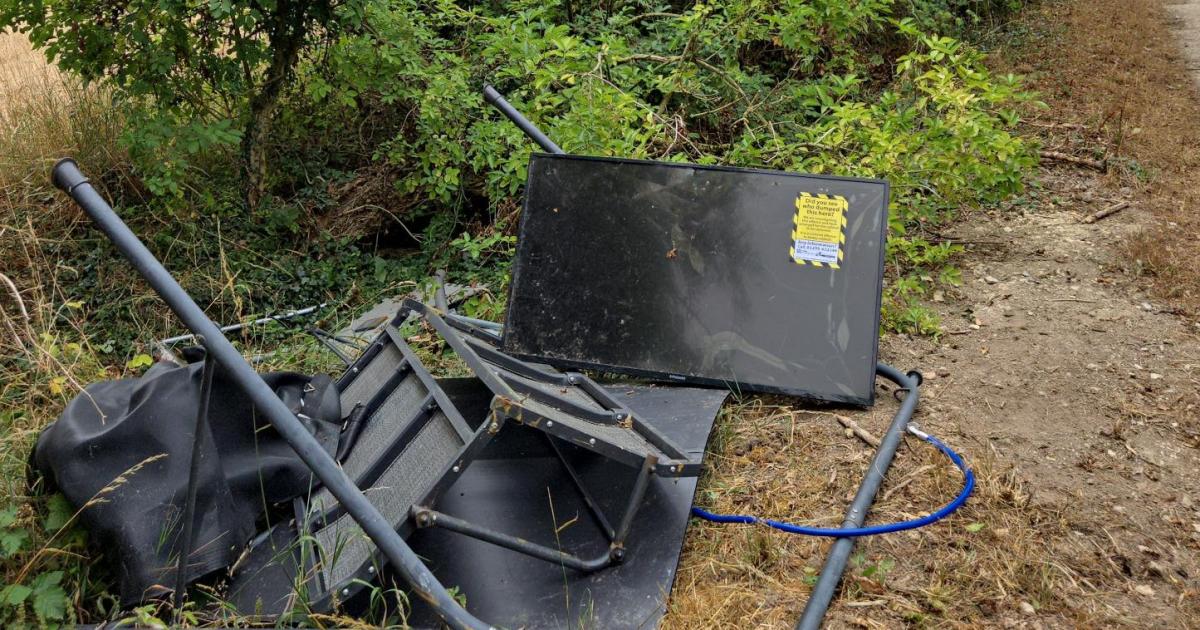 Trampoline and piles of rubbish fly-tipped in Oxfordshire