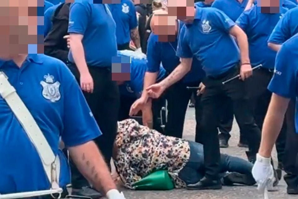 The woman on the ground after the assault