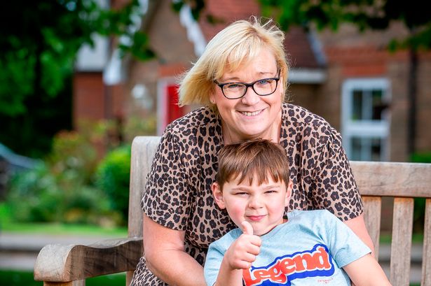 Five-year-old double-amputee Tony Hudgell pictured with mum Paula the day after he completed a 10k charity walk  on his new prosthetic legs
