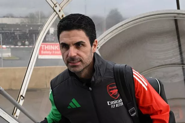Arsenal Manager Mikel Arteta boards a plane at Luton Airport