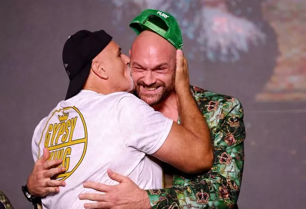 John Fury embraces his son, Tyson Fury