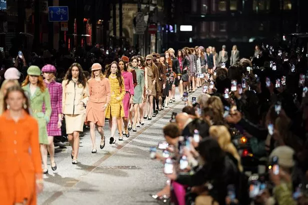 Models walk the runway during the CHANEL Metiers D'Art Fashion Show in December 2023