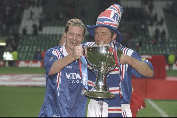 Paul Gascoigne (left) and teammate Ally McCoist pose with the trophy after the Scottish Coca Cola cup final between Rangers and Hearts at Celtic Park in Glasgow. Rangers won 4-3.