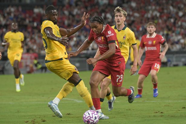 Fikayo Tomori of AC Milan competes for the ball with Rio Ngumoha of Liverpool during the friendly match at Kai Tak Sports Park on July 26 2025 in Hong Kong