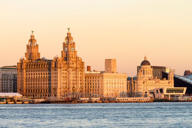 Liver Buildings and Liverpool waterfront skyline, England.