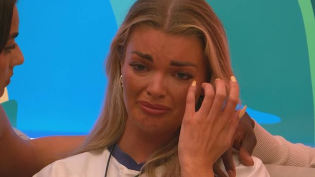 Young blonde woman crying