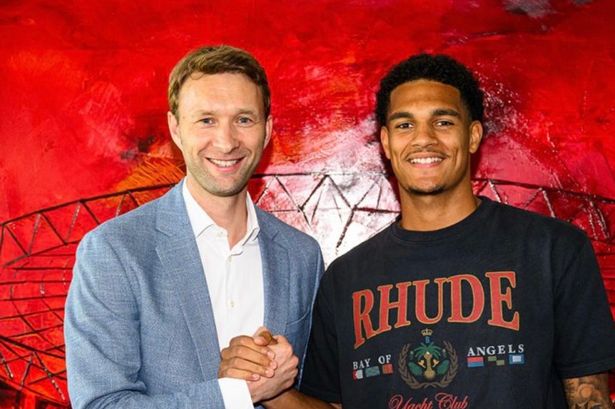 Bayer Leverkusen sporting director Simon Rolfes poses with new signing Jarell Quansah from Liverpool