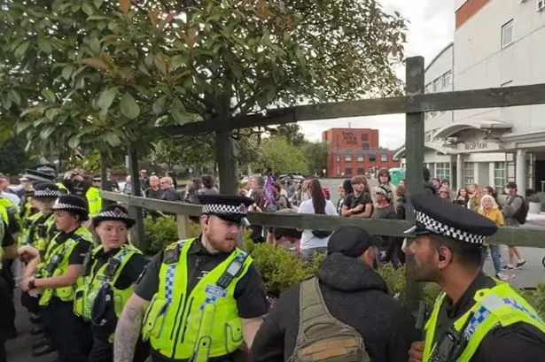 Police created a barrier around the hotel as the two groups clashed