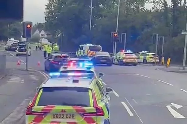 Police at the scene of the incident on Wilmslow Road
