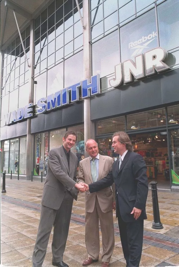 A story about Wade Smith and Arcadia on June 30, 1998 in the Liverpool ECHO newspaper.Pictured, David and Robert Wade Smith shake hands with Richard Maney (centre) of the Arcadia group