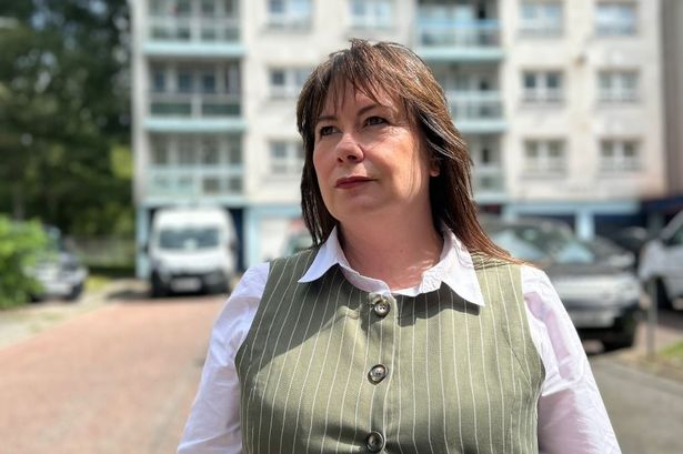 Anneliese Midgley, MP for Knowsley, in front of the flat block in Stockbridge Village where her nan used to live