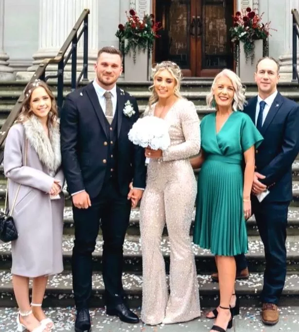 Bonnie beams at her wedding with her husband Ollie