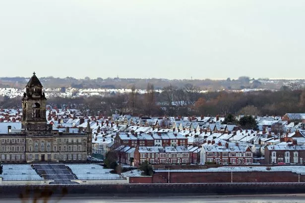 Snowy rooftops and Wallasey Town Hall, Wirral. 