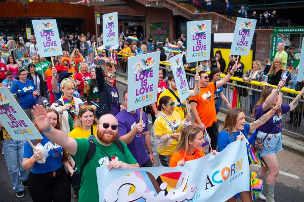 People turned out with signs saying "love is love" as thousands took to the streets for Liverpool Pride