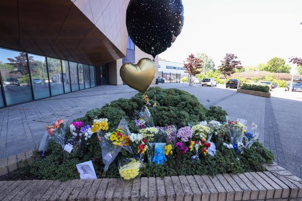Floral tributes have been left to the former teacher who died following a short illness 
