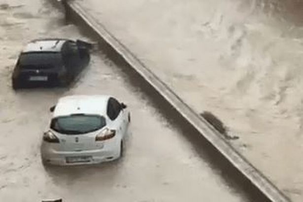 Cars were left submerged after heavy rain in Tarazona, Spain