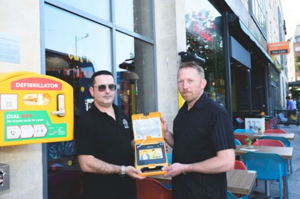 First Bus driver Carlos Santos (left) and Richard Dewdney with the defibrillator @JonCraig Photos
