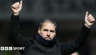 Martin Cifuentes raises both arms into the air and gives a thumbs-up
