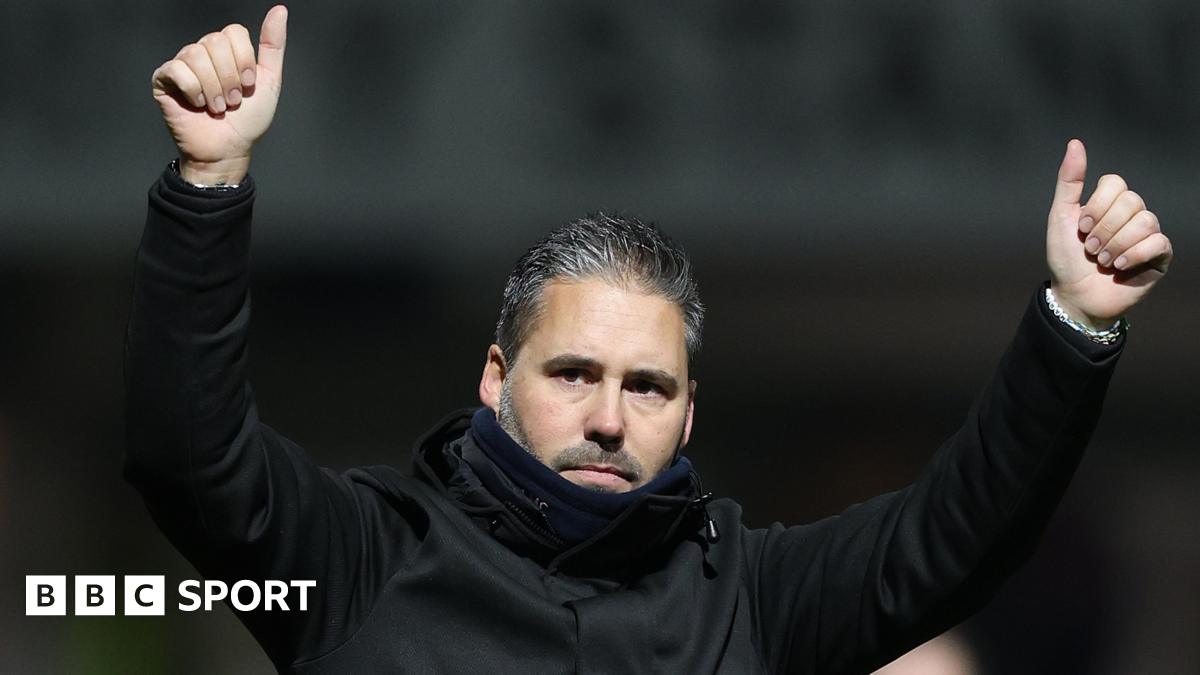 Martin Cifuentes raises both arms into the air and gives a thumbs-up