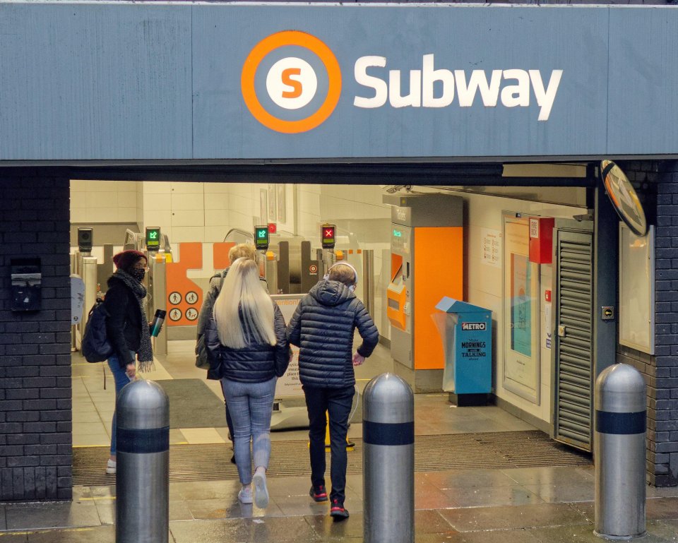 People entering a Glasgow Subway station.