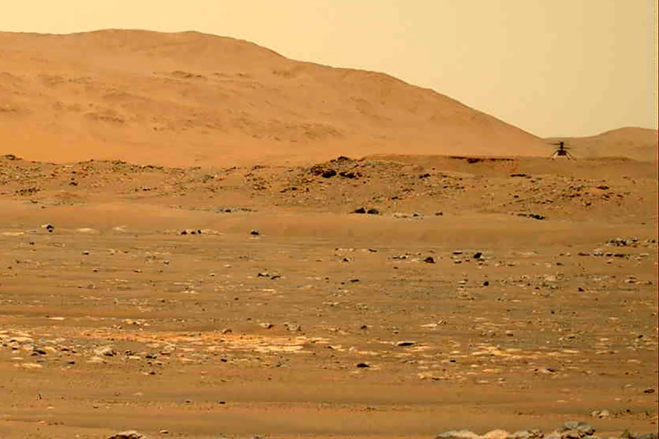 Ingenuity helicopter flying over Mars.