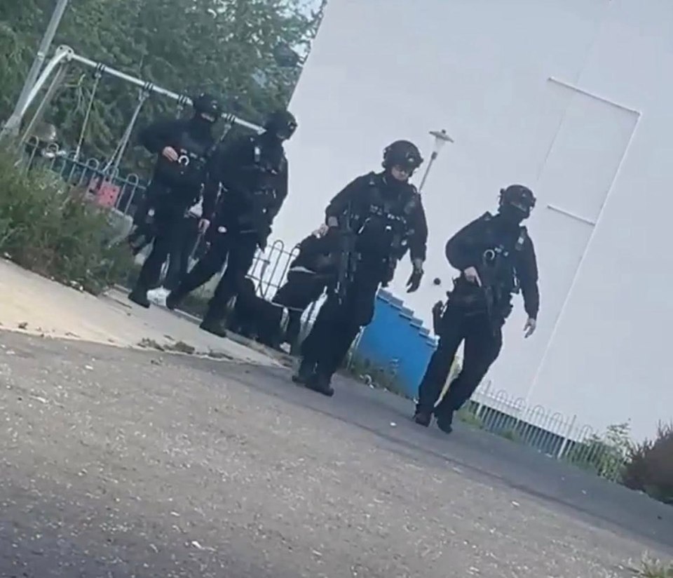 Police officers responding to a reported firearm discharge.