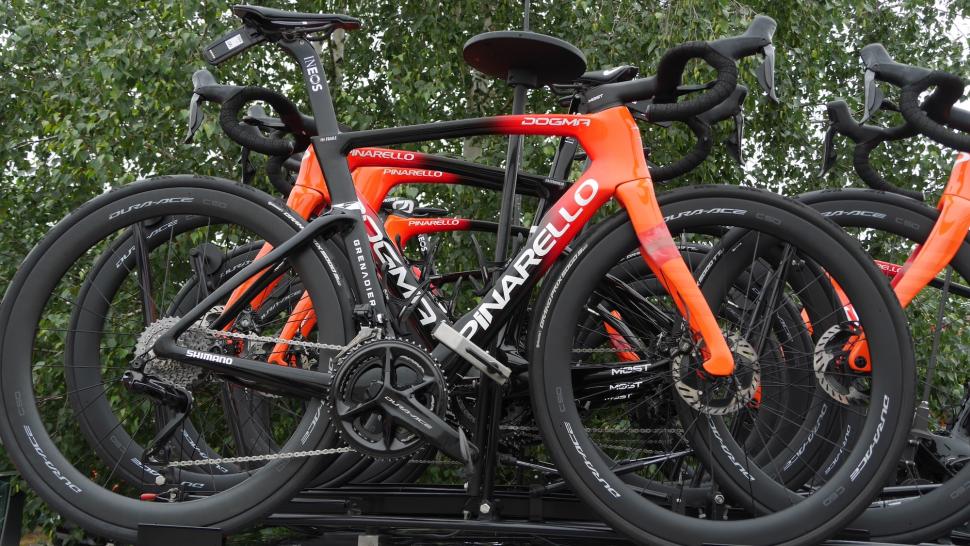 orange, red and black pinarello dogm road bike